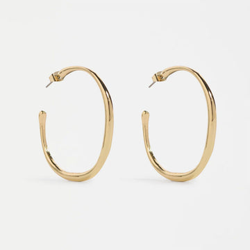 Gold hoop earrings on a white background