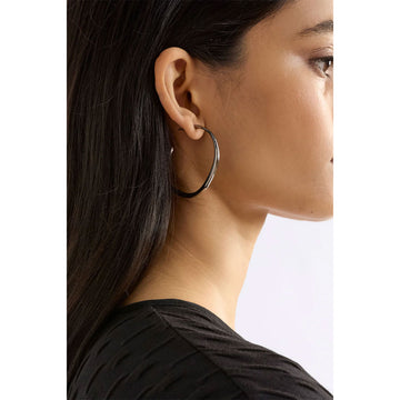 Gold hoop earrings on a white background