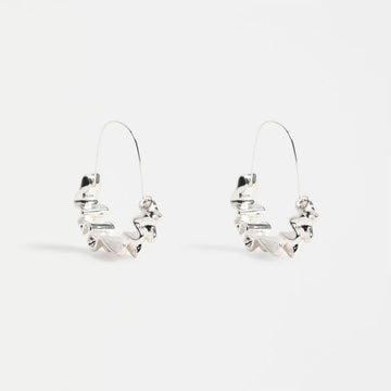 Silver hoop earrings on a white background.