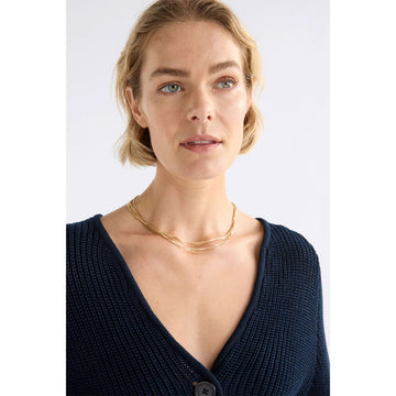 Necklace with multiple blue strands on a white background.