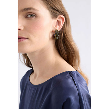 A pair of hoop earrings with dark green beads.