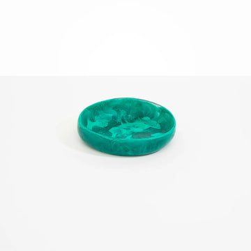 A small teal green resin bowl with shallow sides.