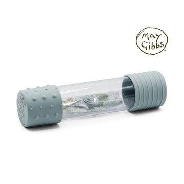 A clear tube with grey blue rubber ends and an assortment of glittery objects inside.