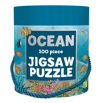 A blue bucket shaped container with the heading 'Ocean 100 piece Jigsaw Puzzle' on the front with illustrations of fish and reef.