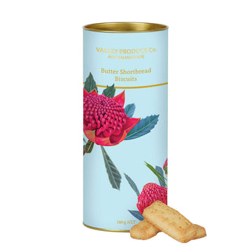 Cylindrical container of butter shortbread biscuits with Waratah flowers on a white background.