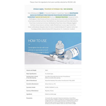 White bottle with blue label on a white background.