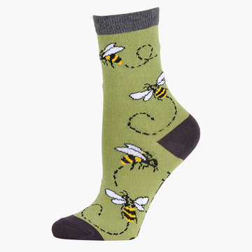 A kids sock in green with a grey heel, toe and cuff printed with bees.