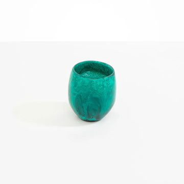 A teal green resin tumbler.