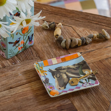 A square ceramic trinket tray illustrated with a horse and flowers.