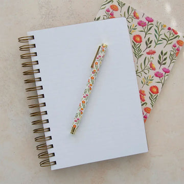 Journal with floral design and 'earth greetings' branding on a white background.