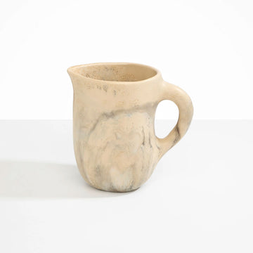 A resin jug in light brown swirls.