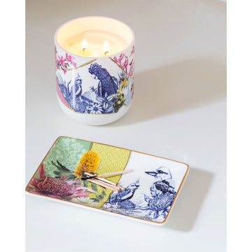 A ceramic rectangle trinket tray illustrated with a blue and white design of birds and flowers on the right and a full colour floral design on the left.