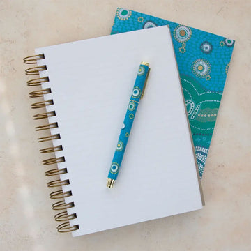Journal with a decorative cover featuring earth greetings branding.