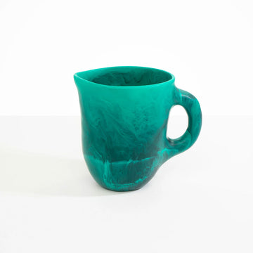 A teal green resin jug.