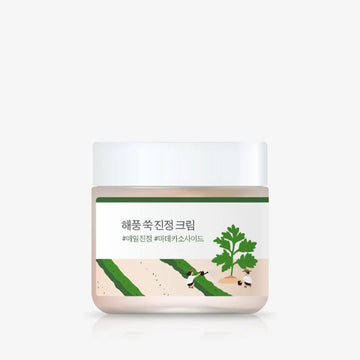 Cosmetic jar with a green label featuring Korean text and gardening inspired images on a white background