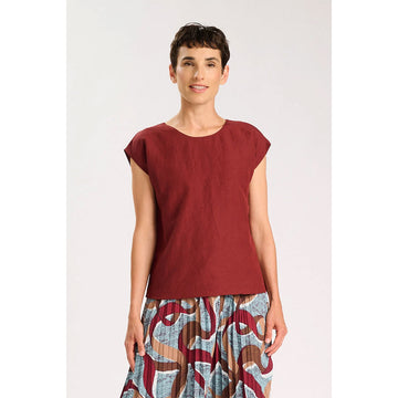 Red sleeveless top on a white background