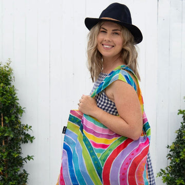 A reusable shopping bag illustrated with colourful rainbows.
