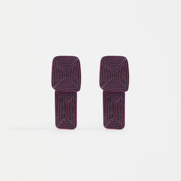 A pair of stud drop earrings in mulberry with a rectangle and square design.