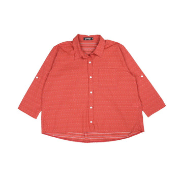 Red patterned shirt on a white background.