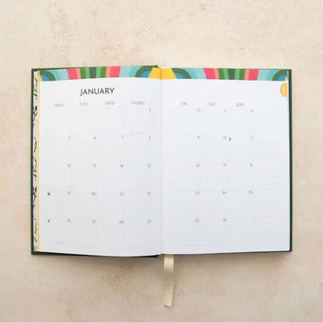 Green planner with floral design and '2026' text on a light background.