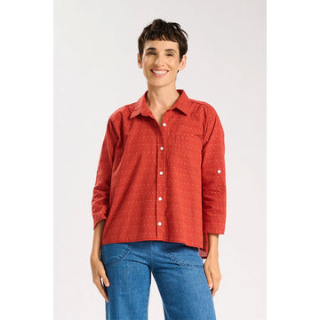 Red patterned shirt on a white background.