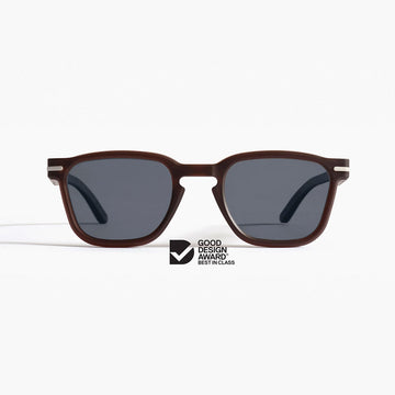 Sunglasses with brown frame and dark lenses on a white background, featuring Good Design Award logo.