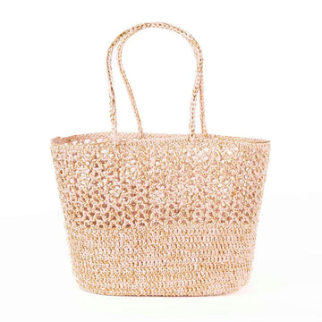 A woven basket style handbag in a light pink beige colour.