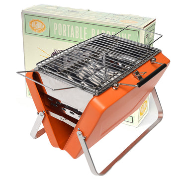 A foldable barbeque in orange in front of its packaging box.