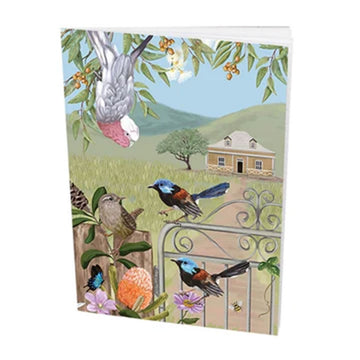 Front cover of a notebook illustrated with birds on a gate and plants with a house in the background.
