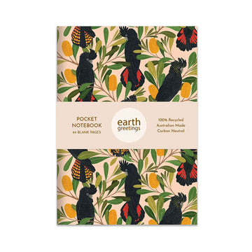 Pocket notebook with a design of black cockatoos and banksia on a beige background, featuring the brand 'earth greetings'.