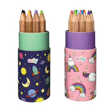 Two sets of coloured pencils in cylinder containers. One set has illustrations of space on the container and the other has unicorns and rainbows.