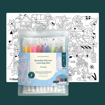 Reusable silicone learning mat with colorful markers on a dark green background.