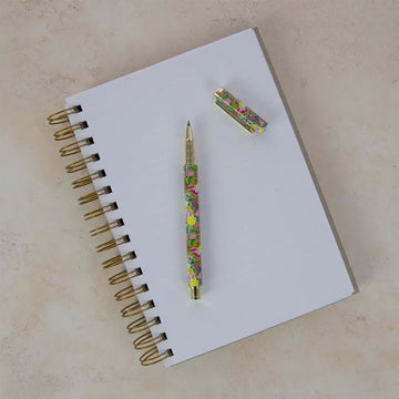 Refillable gel pen in packaging with floral design on a white background.
