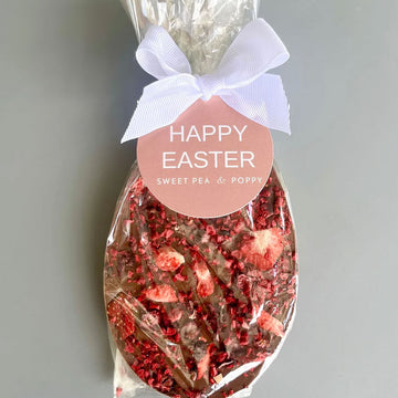 Packaged Easter-themed chocolate with a 'Happy Easter' label on a gray background.