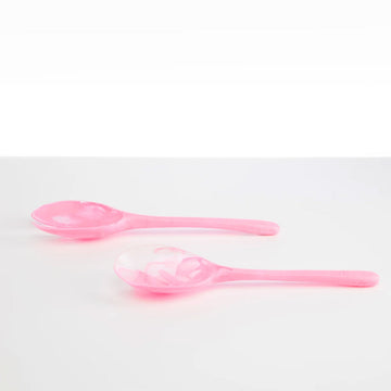 A pair of salad servers made from resin in light pink.