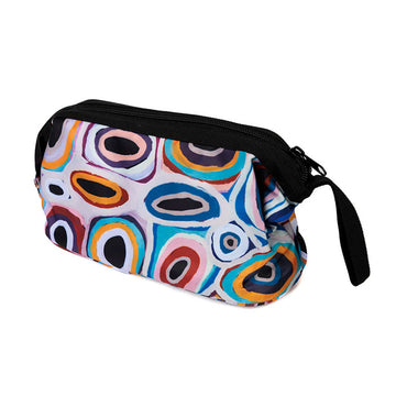 A cosmetic bag printed with artwork by Gladys Kuru Bidu with a thick black zip along the top.