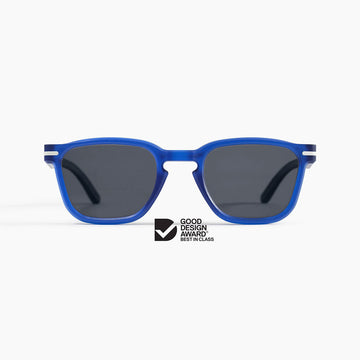 Blue sunglasses with dark lenses on a white background, featuring the Good Design Award logo.