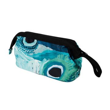 A cosmetic bag printed with artwork by May Wokka Chapman in blue with a thick black zip along the top.