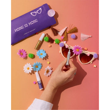 A blue box with the heading 'Decorate Your Own Sunglasses' and an illustration of heart shaped glassed with flowers and gems on the frames.