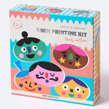 A box titled 'Rock Painting Kit' with illustrations of oval shaped rocks printed with illustrated faces.