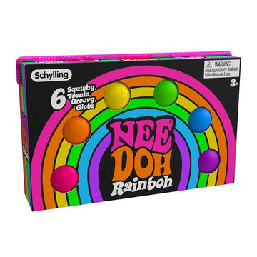 A box with a rainbow printed on the front with circle cut outs showing coloured balls inside. The box has the heading 'Nee Doh Rainboh'.