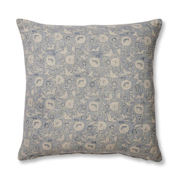 A square cushion printed with a floral design on a blue background.