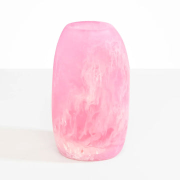 A resin vase with a slight oval shape in light pink.