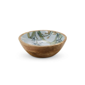 A wooden bowl with the inside printed with blue and yellow flowers with green leaves.