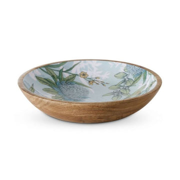 A wooden salad bowl printed with blue and yellow flowers with green leaves on the inside of the bowl.