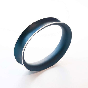 A navy stainless steel bangle.