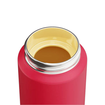 Red water bottle with green cap and yellow handle on a white background.