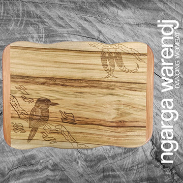A wooden board etched with a kookaburra on a branch.