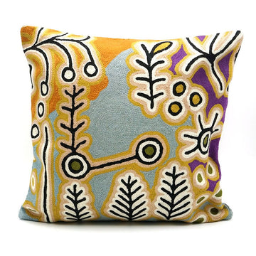 Decorative pillow with a colorful abstract pattern on a white background.