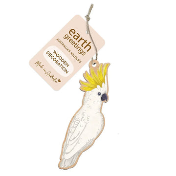 Wooden cockatoo decoration with 'Earth Greetings' tag on a white background.